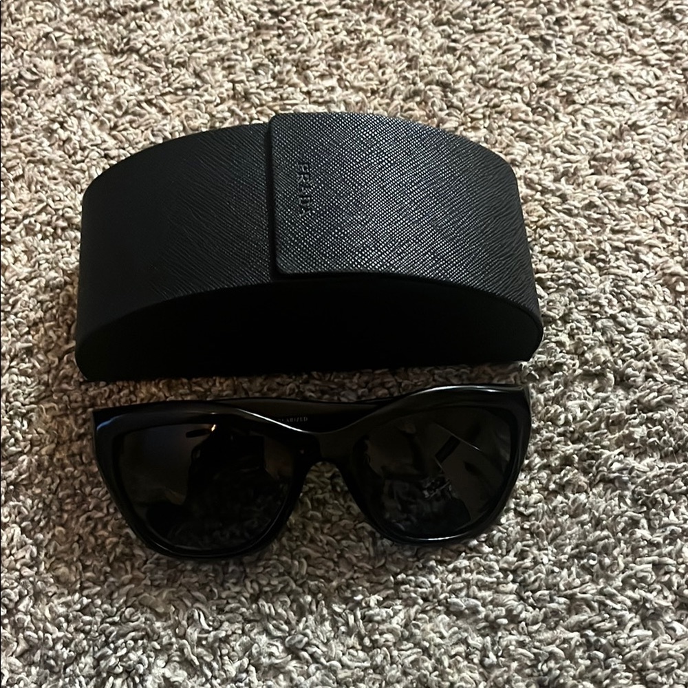 PRADA SPR 02Q Polarized Sunglasses with grey gradient lenses.